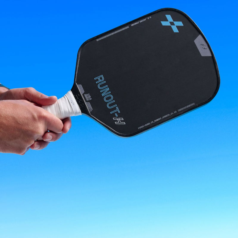 Person holding the F+B Runout - Hybrid Carbon Fiber Pickleball Paddle